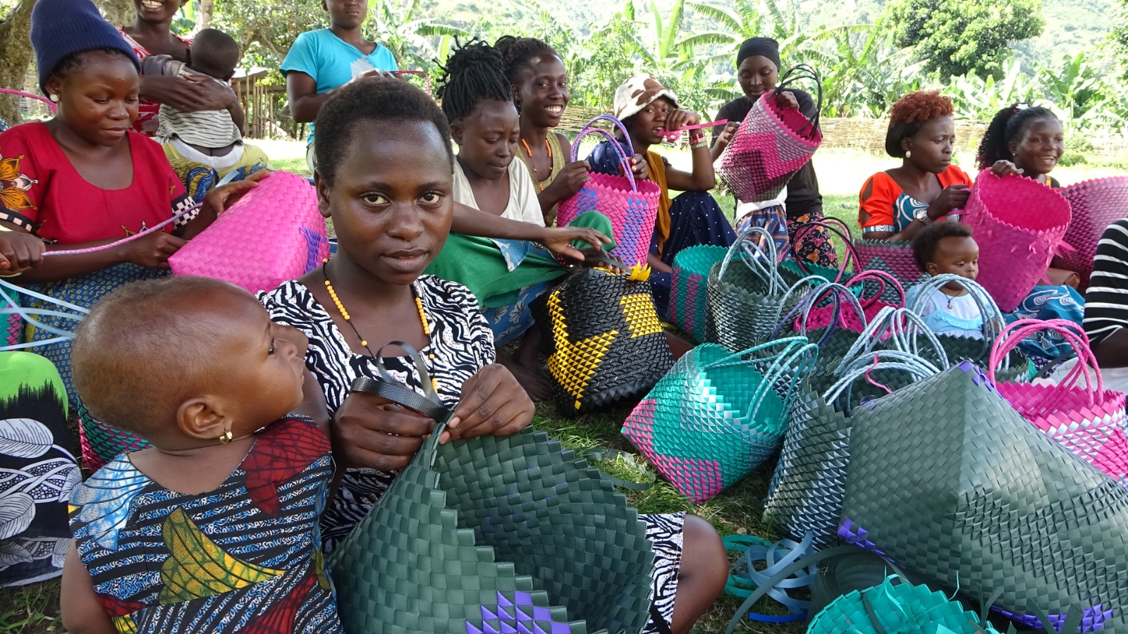 A community artisan practices weaving during skills training.