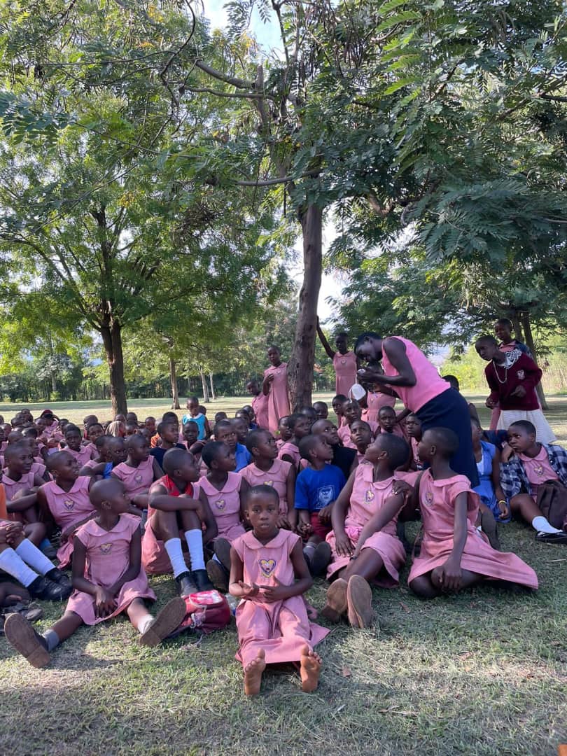Girls outdoors during a community education activity.