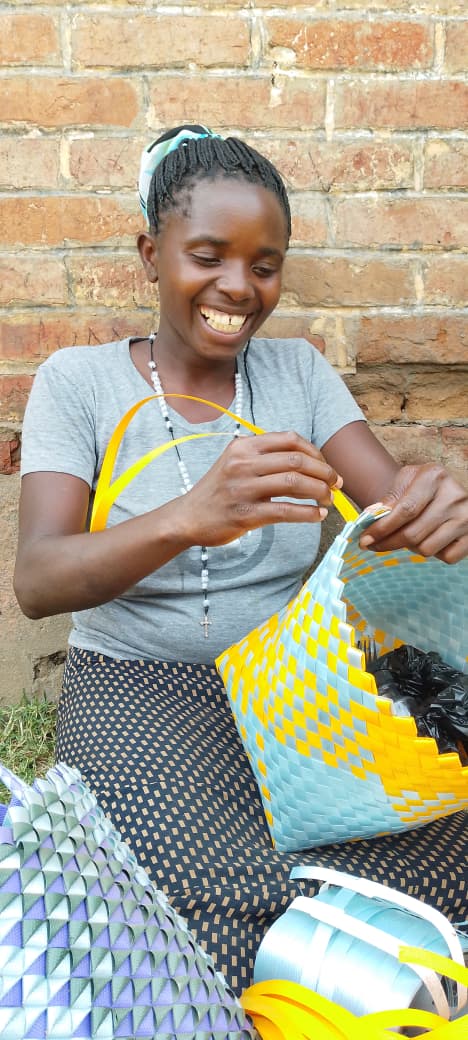 A young woman learns basket weaving during vocational training.
