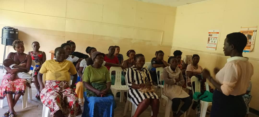 SPES For Community staff and beneficiaries gather during a community outreach activity.