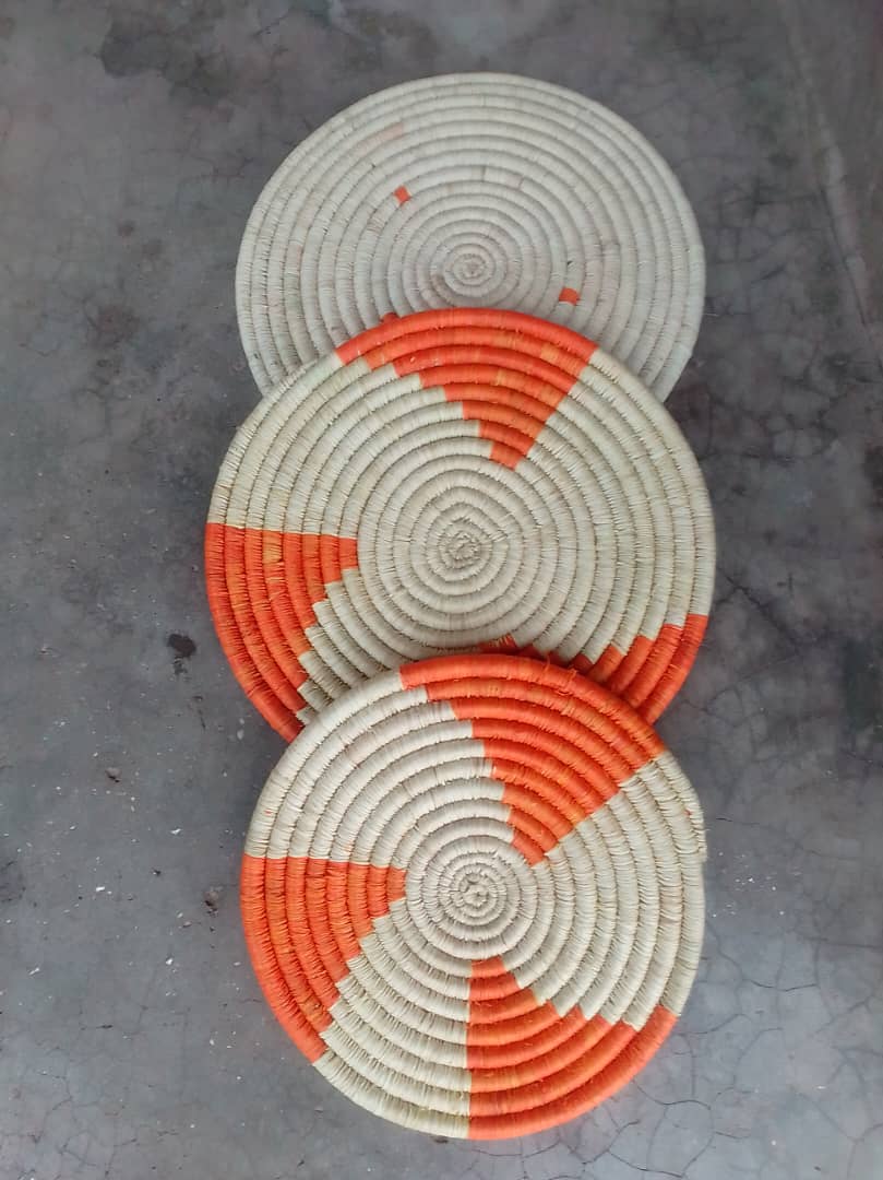 Orange and red handwoven mat.