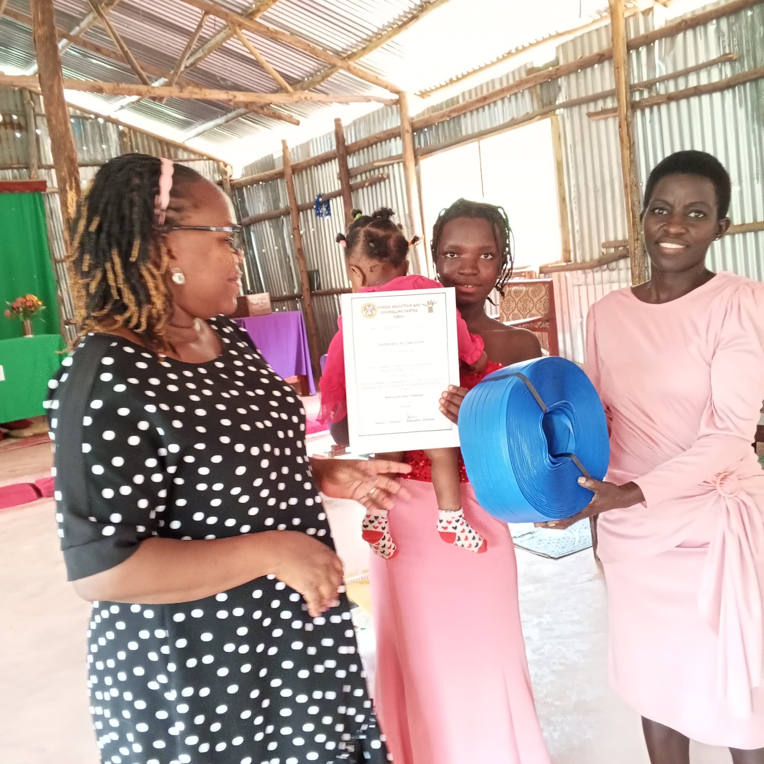 Single young mothers with their baskets after three months of training.